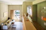 Modern living room, view into bedroom
