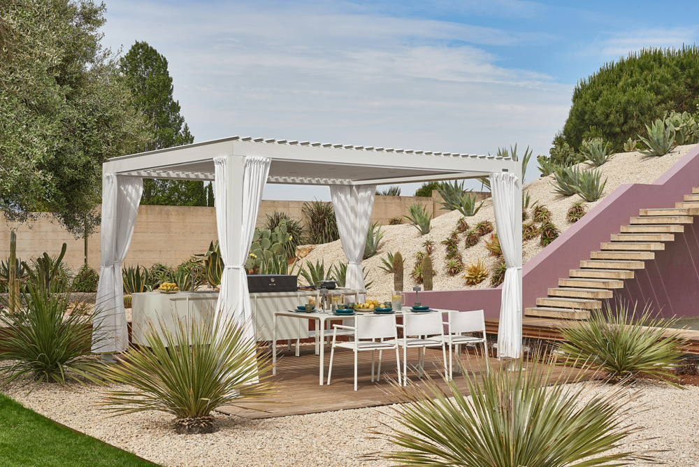 Emu 2 Emily kitchen + Nuvola pergola + Terramare armchairs + Terramare tables + Luciole lamps
