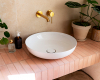 ovales waschbecken rosa fliesen messing armatur Caroline Reichel Posting Grohe decohome.de