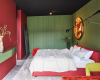 Schlafzimmer gruen rot Bungalow Philip Kottlorz decohome.de
